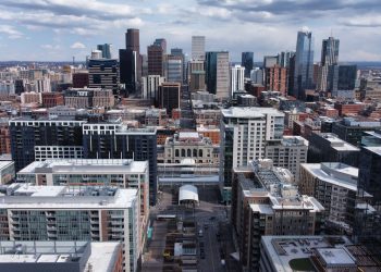 Aerial view of skyscrapers of Denver, Colorado under a cloudy sky
