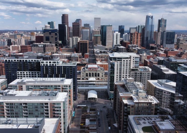 Aerial view of skyscrapers of Denver, Colorado under a cloudy sky